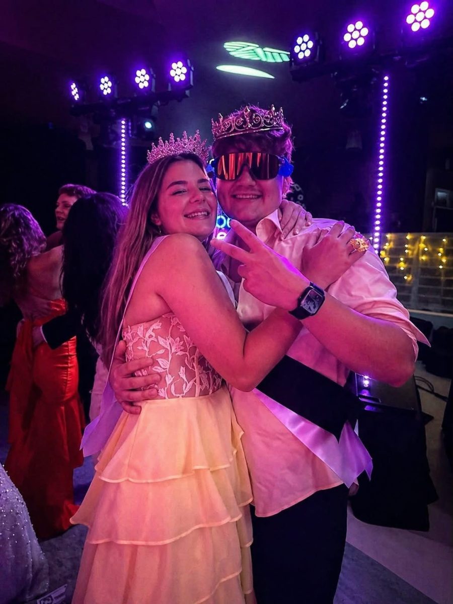 Senior prom queen Ryllen Beasley and king Landon Mayhew posing together after being crowned.